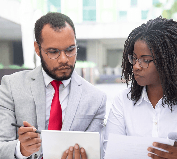 Two care business consultants reviewing a financial forecast together