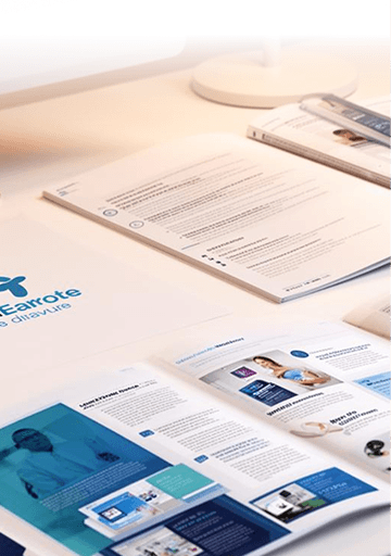 Printed healthcare brochures and branded documents on a desk