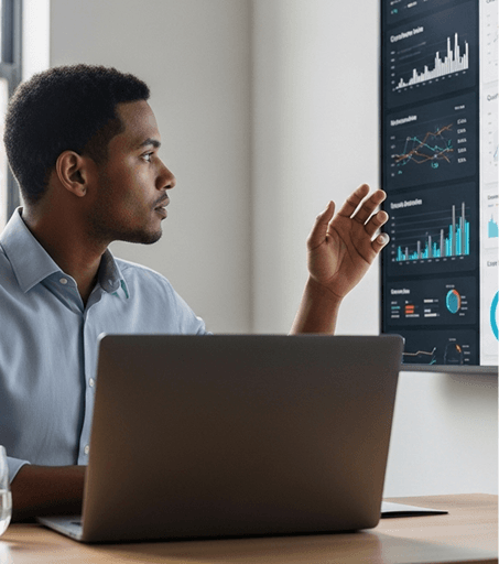 A care marketer reviewing performance dashboards on screen