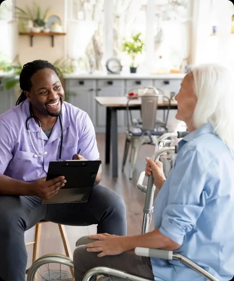 Care professional greeting an older client