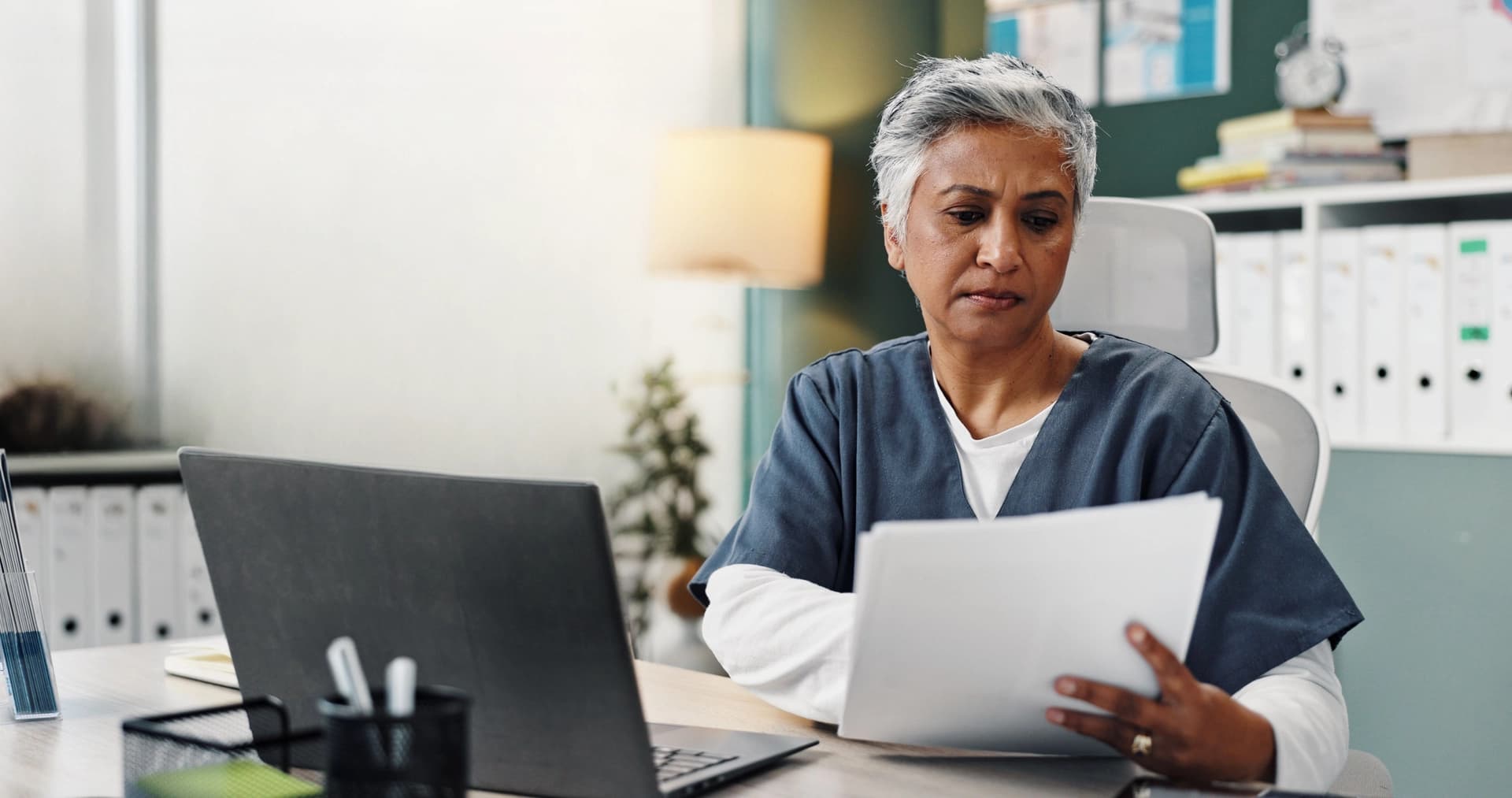 Doctor with laptop and patient