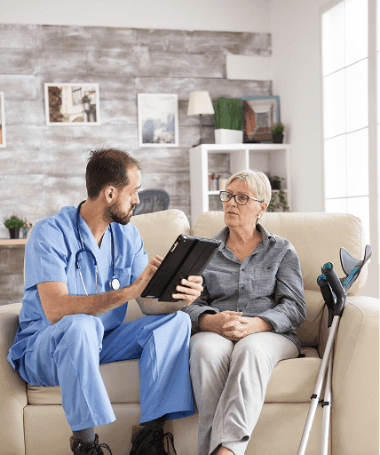 A nurse reviewing a care plan with a client at home