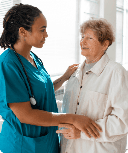 A care worker greeting an older client