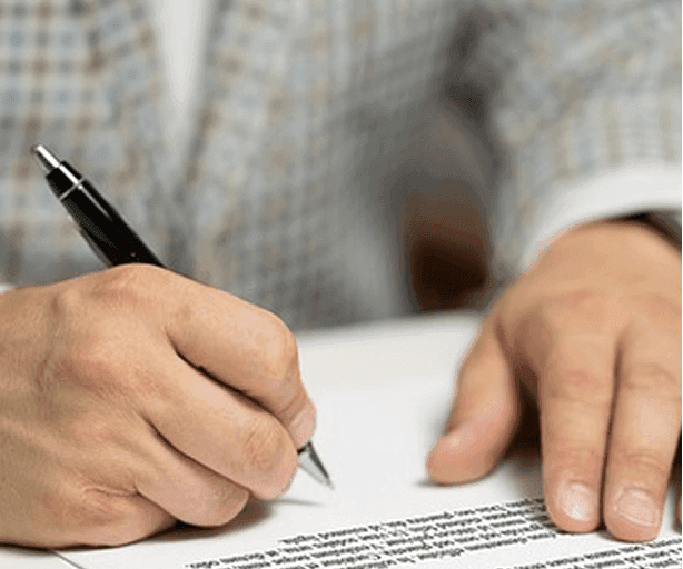 Provider signing supported accommodation registration paperwork