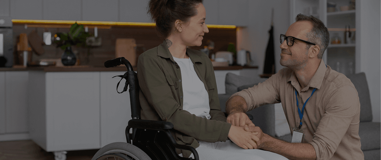 A support worker assisting a person in their own home