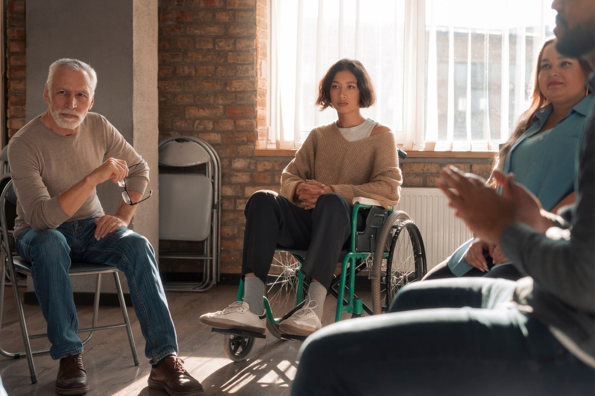Supported living residents in a group session