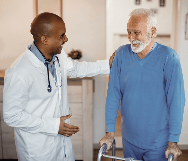 A care worker supporting an older person at home