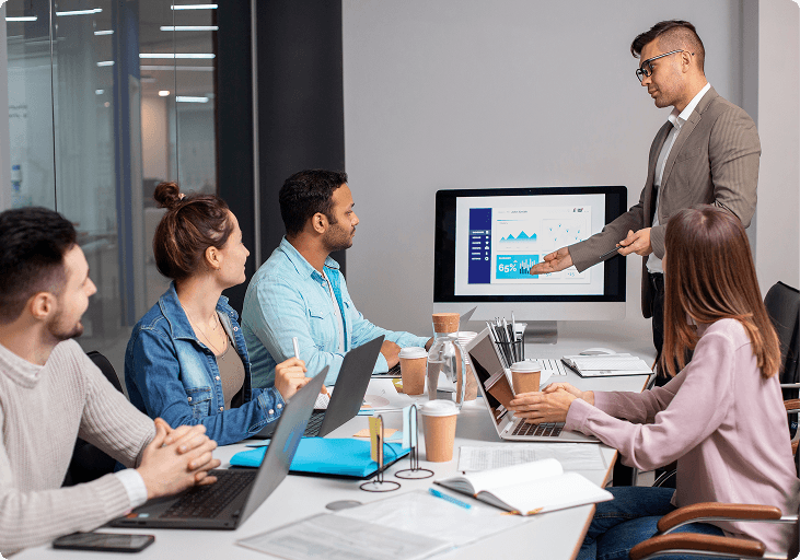 A team reviewing a commissioning presentation together