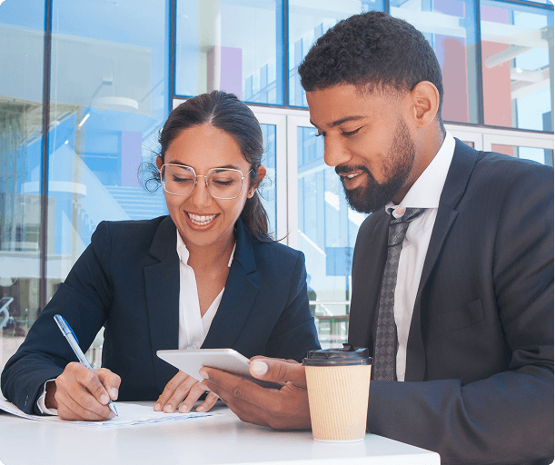 Two professionals reviewing a document together at a table