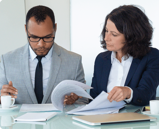 Commissioners reviewing a tender submission together
