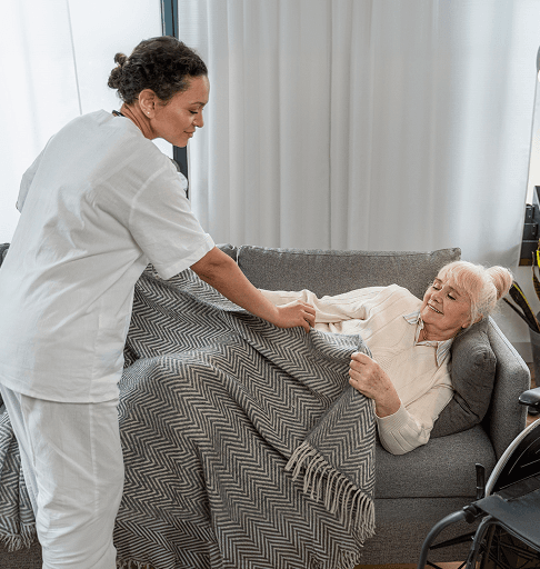 A care worker supporting an adult with a physical disability