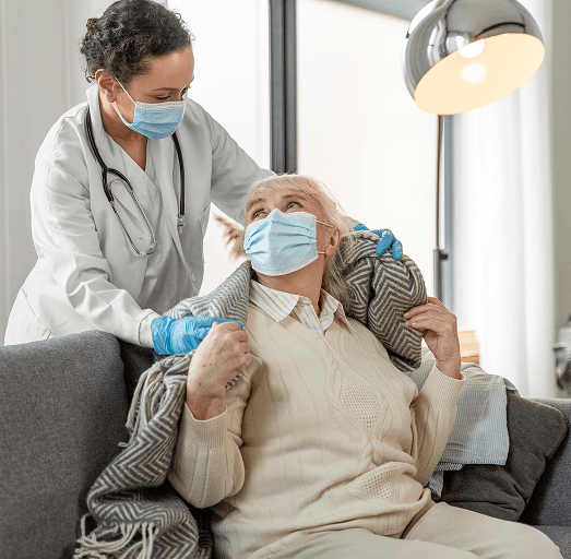 A care worker supporting an older person at home