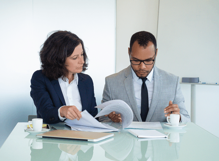 Consultants reviewing RQIA domiciliary care policy documents