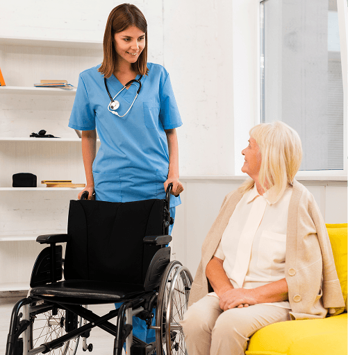 Care worker supporting an extra care resident with a wheelchair