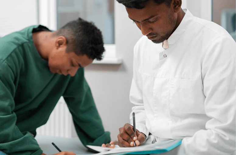 Two care professionals completing a reablement tender submission