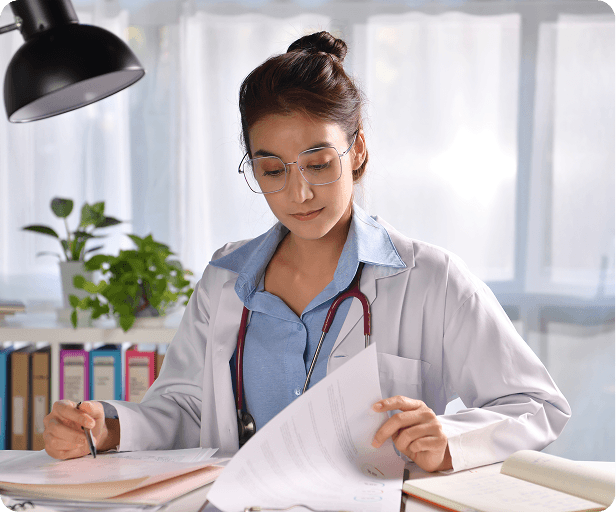 Care professional reviewing tender documents