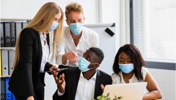 Consultants reviewing multi-regulator compliance