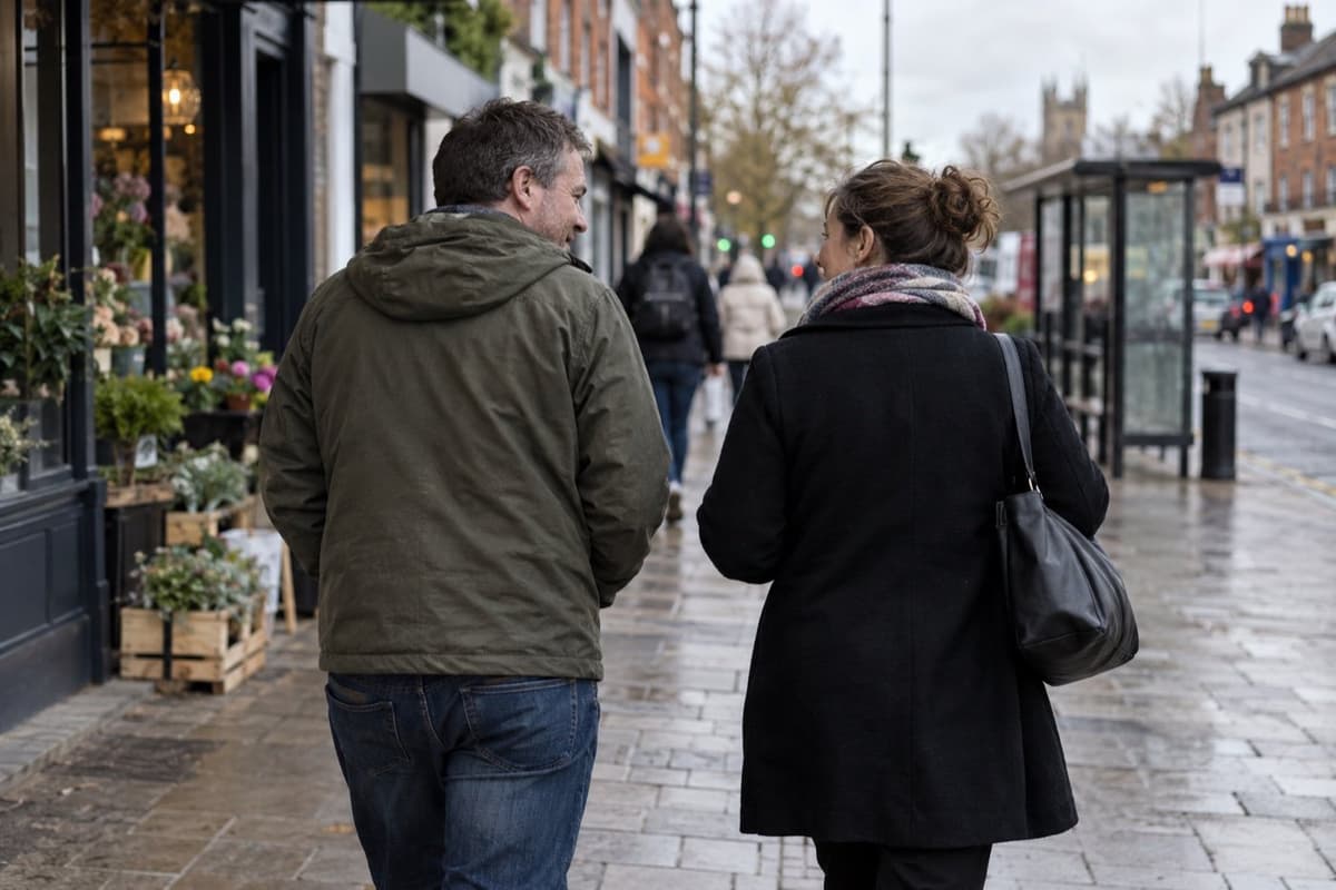 Two adults walking together through a Hertfordshire town centre
